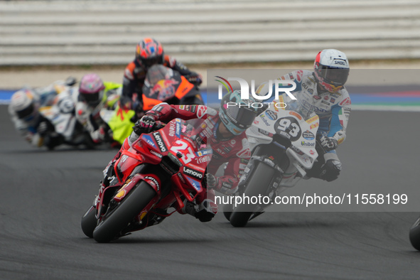 Enea Bastianini and Marc Marquez participate in the Gran Premio Red Bull di San Marino e della Riviera di Rimini Grand Prix Race MotoGP on S...