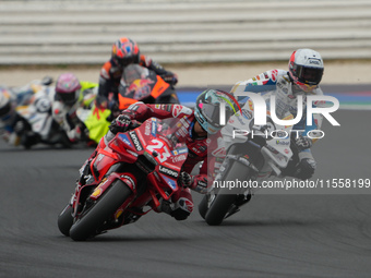 Enea Bastianini and Marc Marquez participate in the Gran Premio Red Bull di San Marino e della Riviera di Rimini Grand Prix Race MotoGP on S...