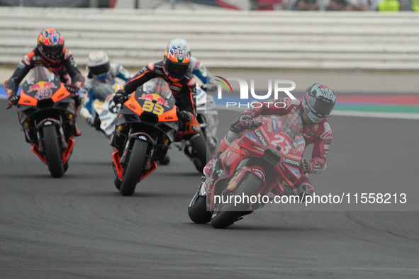 Enea Bastianini and Brad Binder participate in the Gran Premio Red Bull di San Marino e della Riviera di Rimini Grand Prix Race MotoGP on Su...