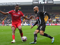 David McGoldrick of Notts County is under pressure from Zach Awe of Accrington Stanley during the Sky Bet League 2 match between Notts Count...