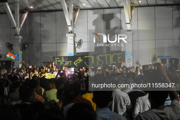 Citizens participate in a night vigil as the protest against the rape and murder of a second-year PGT doctor enters its 30th consecutive day...