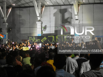 Citizens participate in a night vigil as the protest against the rape and murder of a second-year PGT doctor enters its 30th consecutive day...