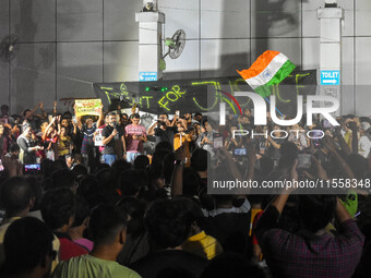 Citizens participate in a night vigil as the protest against the rape and murder of a second-year PGT doctor enters its 30th consecutive day...