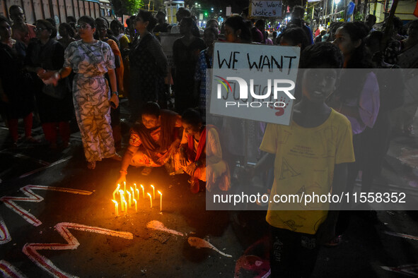 Citizens participate in a night vigil as the protest against the rape and murder of a second-year PGT doctor enters its 30th consecutive day...