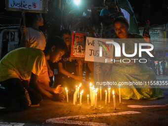 Citizens participate in a night vigil as the protest against the rape and murder of a second-year PGT doctor enters its 30th consecutive day...