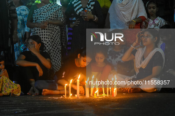 Citizens participate in a night vigil as the protest against the rape and murder of a second-year PGT doctor enters its 30th consecutive day...