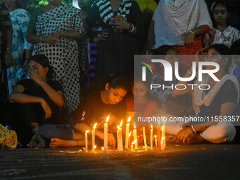 Citizens participate in a night vigil as the protest against the rape and murder of a second-year PGT doctor enters its 30th consecutive day...