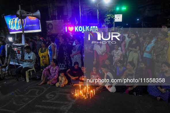 Citizens participate in a night vigil as the protest against the rape and murder of a second-year PGT doctor enters its 30th consecutive day...