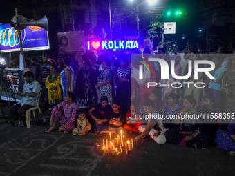 Citizens participate in a night vigil as the protest against the rape and murder of a second-year PGT doctor enters its 30th consecutive day...