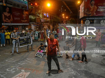 Citizens participate in a night vigil as the protest against the rape and murder of a second-year PGT doctor enters its 30th consecutive day...