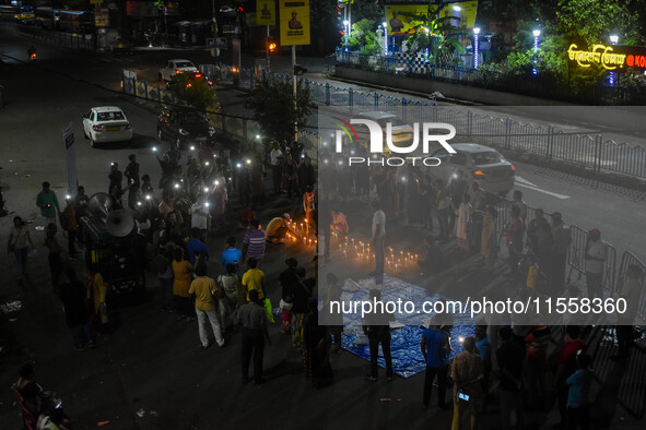 Citizens participate in a night vigil as the protest against the rape and murder of a second-year PGT doctor enters its 30th consecutive day...