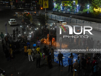 Citizens participate in a night vigil as the protest against the rape and murder of a second-year PGT doctor enters its 30th consecutive day...