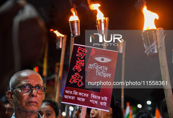 Citizens participate in a night vigil as the protest against the rape and murder of a second-year PGT doctor enters its 30th consecutive day...