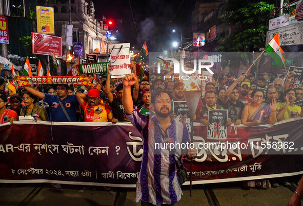 Citizens participate in a night vigil as the protest against the rape and murder of a second-year PGT doctor enters its 30th consecutive day...