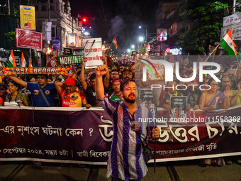 Citizens participate in a night vigil as the protest against the rape and murder of a second-year PGT doctor enters its 30th consecutive day...