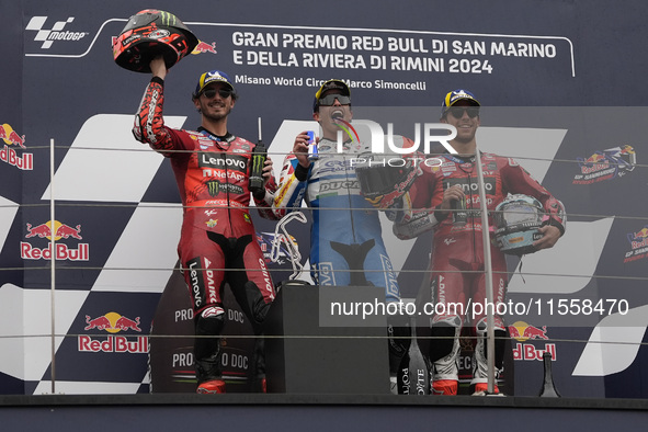 Francesco Bagnaia of Italy and Ducati Lenovo Team (L), Marc Marquez of Spain and Gresini Racing MotoGP (C), and Enea Bastianini of Italy and...