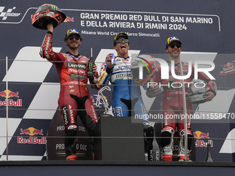 Francesco Bagnaia of Italy and Ducati Lenovo Team (L), Marc Marquez of Spain and Gresini Racing MotoGP (C), and Enea Bastianini of Italy and...