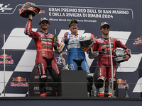 Francesco Bagnaia of Italy and Ducati Lenovo Team (L), Marc Marquez of Spain and Gresini Racing MotoGP (C), and Enea Bastianini of Italy and...