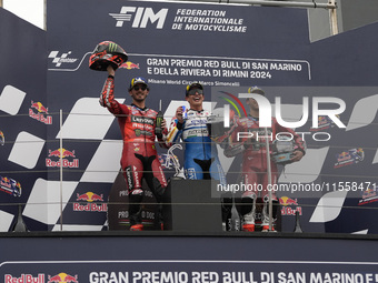 Francesco Bagnaia of Italy and Ducati Lenovo Team (L), Marc Marquez of Spain and Gresini Racing MotoGP (C), and Enea Bastianini of Italy and...