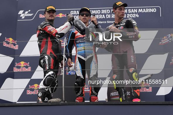 Aron Canet of Spain and Fantic Racing (L), Ai Ogura of Japan and MT Helmets - MSI (C), and Tony Arbolino of Italy and ELF Marc VDS Racing Te...