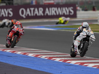 Marc Marquez rides on track in front of Francesco Bagnaia of Italy and the Ducati Lenovo Team during the Race of MotoGP of San Marino at Mis...