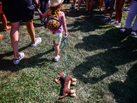 A child with a toy attends the 26th Dachshund March in Krakow, Poland on September 8th, 2024. After a few years break an annual parade  retu...