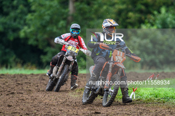 Mark Whitingham (11) leads Georgina Richardson (13) in the Adult Motocross Support Class during the ACU British Upright Championships in Gaw...