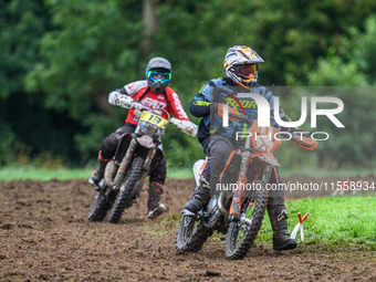 Mark Whitingham (11) leads Georgina Richardson (13) in the Adult Motocross Support Class during the ACU British Upright Championships in Gaw...