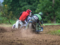 Billy Winterburn and Ryan Wharton (94) (Wharton wearing 48) ride inside Nick Bull and Nathan Alder (500) in the 1000cc Sidecar Class during...