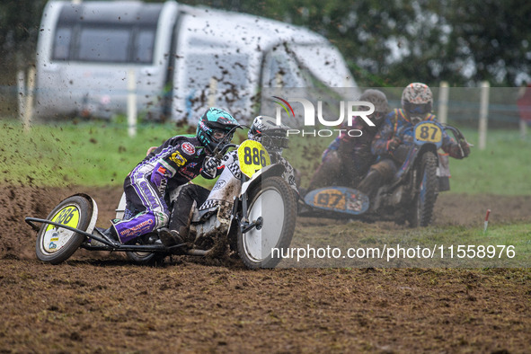 Phill Rowlands and Tom Rowlands (886) lead Richard Fred Jenner and Scott Gutteridge (87) in the 500cc Sidecar Class during the ACU British U...