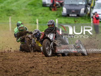 Andy Minard and Lewis Davis (19) lead Billy Winterburn and Ryan Wharton (94) in the 1000cc Sidecar Class during the ACU British Upright Cham...