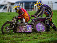 Clint Blondel and Max Chadwick (10) attempt to push start their machine in the mud in the 1000cc Sidecar Class during the ACU British Uprigh...