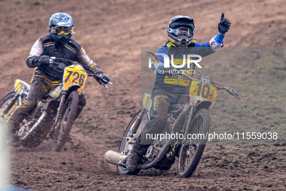 Tony Atkin (10) celebrates winning the British Upright 500cc Championship ahead of Tim Curnock (726) during the ACU British Upright Champion...