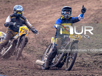 Tony Atkin (10) celebrates winning the British Upright 500cc Championship ahead of Tim Curnock (726) during the ACU British Upright Champion...