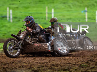 Andy Minard and Lewis Davis (19) lead Billy Winterburn and Ryan Wharton (94) in the 1000cc Sidecar Class Final during the ACU British Uprigh...