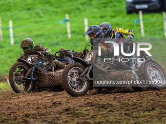 Andy Minard and Lewis Davis (19) and Billy Winterburn and Ryan Wharton (94) battle for second place in the 1000cc Sidecar Class Final during...