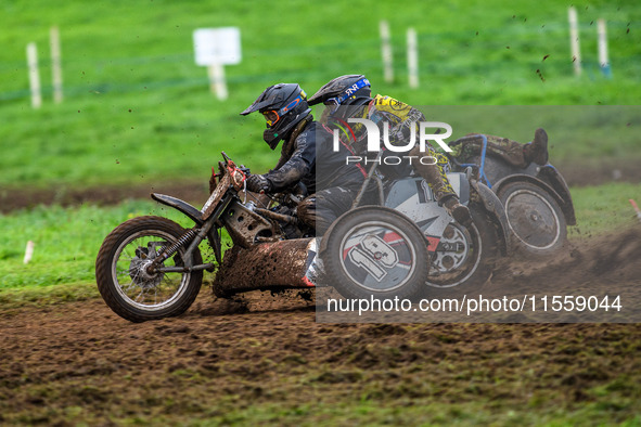 Andy Minard and Lewis Davis (19) and Billy Winterburn and Ryan Wharton (94) battle for second place in the 1000cc Sidecar Class Final during...