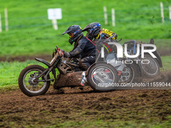 Andy Minard and Lewis Davis (19) and Billy Winterburn and Ryan Wharton (94) battle for second place in the 1000cc Sidecar Class Final during...