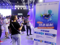 Job seekers learn about the demand for artificial intelligence digital technology positions at a job fair for science and technology talents...