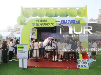 Chinese tennis star Zheng Qinwen speaks for an advertisement of Ant Group during the INCLUSION Conference on the Bund in Shanghai, China, on...