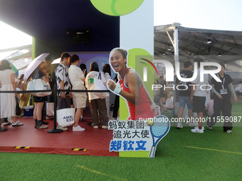 Chinese tennis star Zheng Qinwen speaks for an advertisement of Ant Group during the INCLUSION Conference on the Bund in Shanghai, China, on...