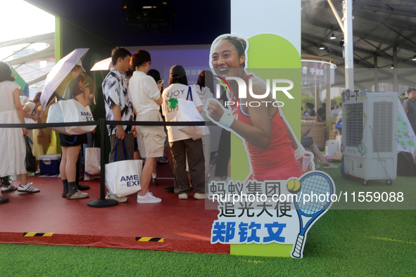 Chinese tennis star Zheng Qinwen speaks for an advertisement of Ant Group during the INCLUSION Conference on the Bund in Shanghai, China, on...