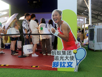 Chinese tennis star Zheng Qinwen speaks for an advertisement of Ant Group during the INCLUSION Conference on the Bund in Shanghai, China, on...