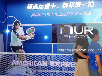 Chinese tennis star Zhang Zhizhen speaks for an advertisement of American Express during the INCLUSION Conference on the Bund in Shanghai, C...