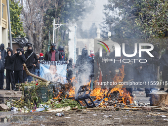 Protesters light barricades at the General Cemetery in Chile on September 8, 2024, where the traditional pilgrimage commemorating the coup d...