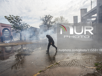 Demonstrators clash with police at the General Cemetery in Chile on September 8, 2024, at the end of the traditional pilgrimage commemoratin...