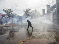 Demonstrators clash with police at the General Cemetery in Chile on September 8, 2024, at the end of the traditional pilgrimage commemoratin...