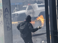 Demonstrators clash with police at the General Cemetery in Chile on September 8, 2024, at the end of the traditional pilgrimage commemoratin...