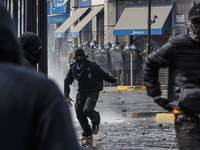 Demonstrators clash with police at the General Cemetery in Chile on September 8, 2024, at the end of the traditional pilgrimage commemoratin...