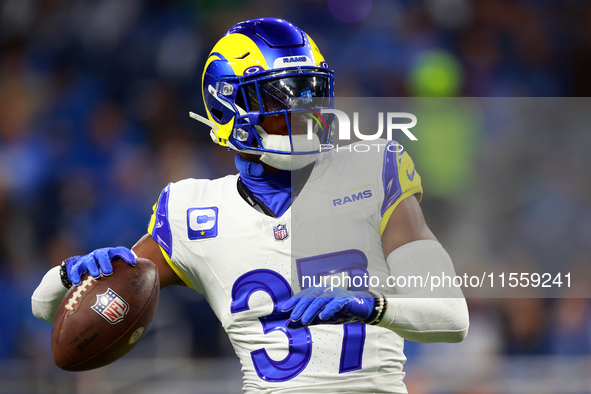 DETROIT,MICHIGAN-SEPTEMBER 9:  Safety Quentin Lake (37) of the Los Angeles Rams reaches to throw the ball during warmups ahead of a game bet...